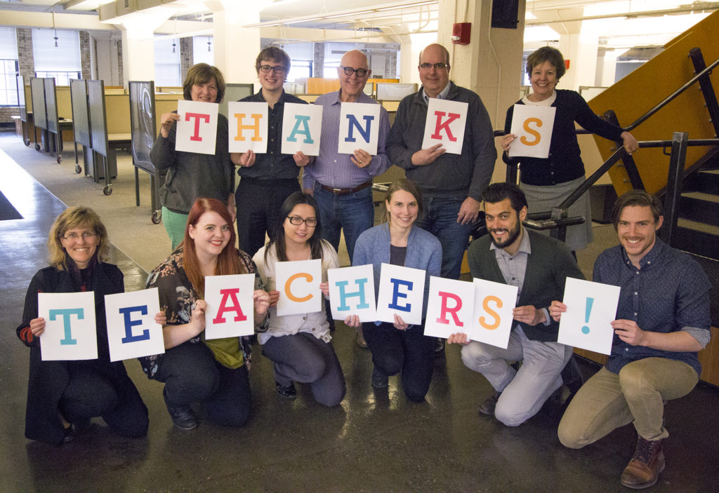 staff holding thanks teachers sign